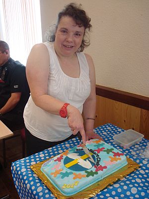 Beth cuts a cake